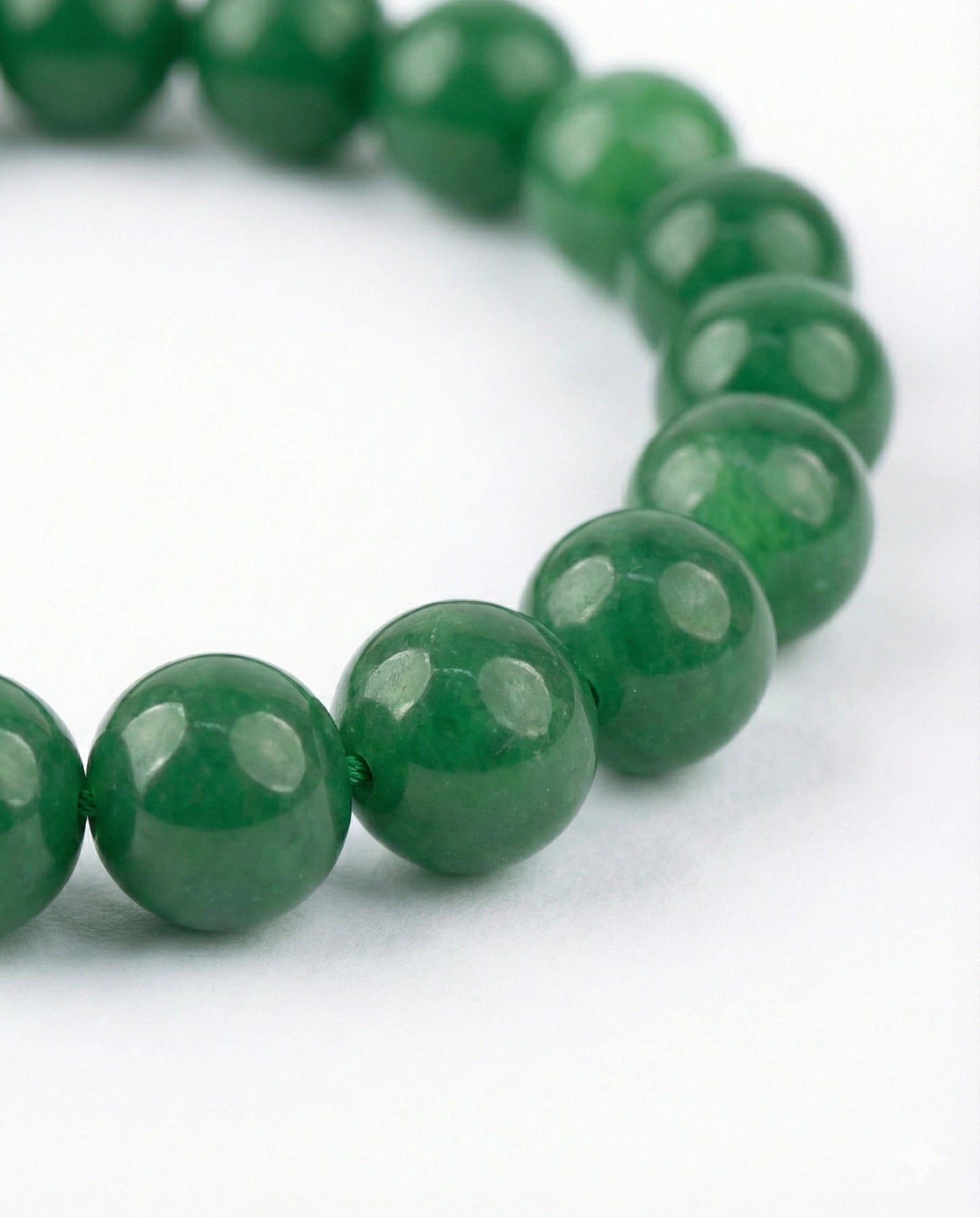 Attract luck and prosperity with this Natural Green Jade beaded bracelet. Handcrafted with premium 8mm green gemstones for harmony and abundance.