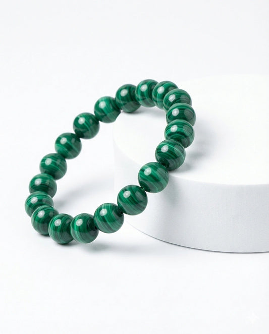 Natural Malachite beaded bracelet featuring 8mm green banded stones on white background.