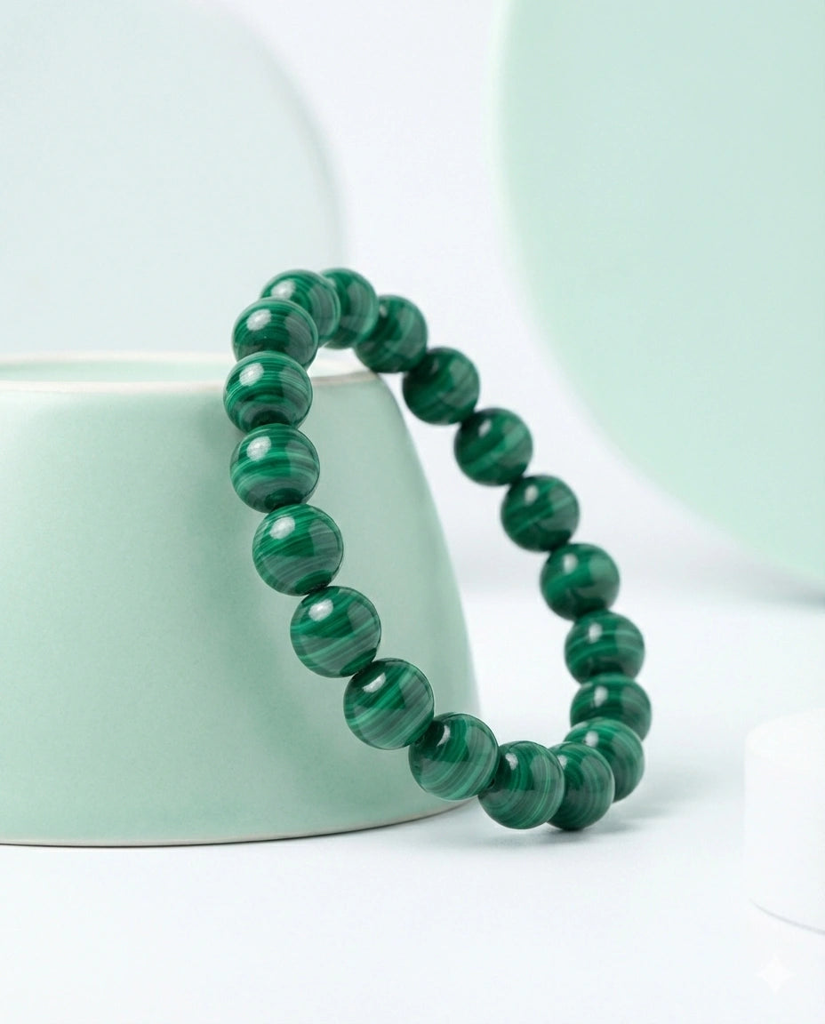 Natural Malachite beaded bracelet featuring 8mm green banded stones on white background.