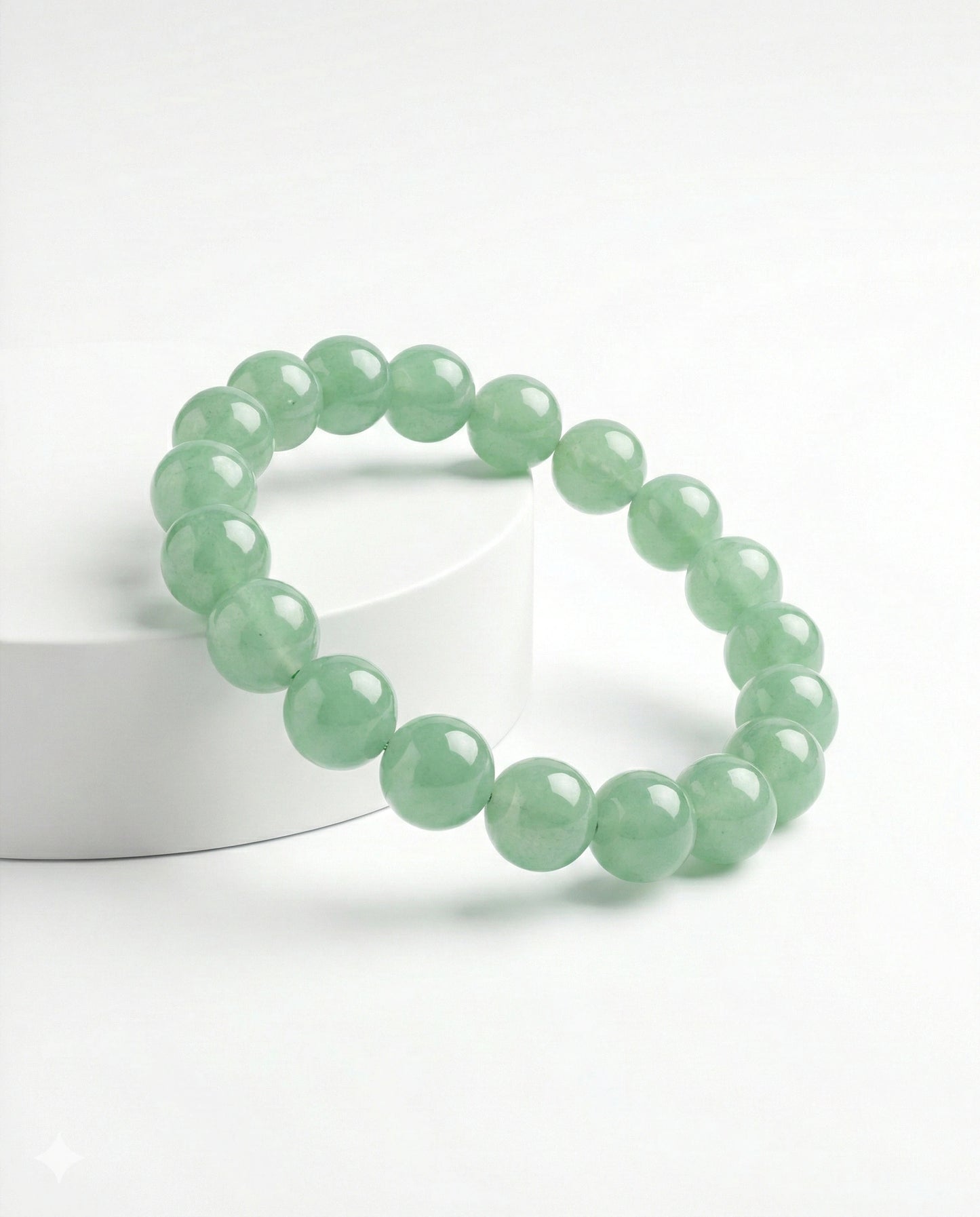 Natural Green Aventurine beaded bracelet featuring 8mm light green translucent stones on white background.