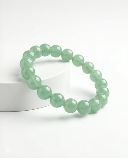 Natural Green Aventurine beaded bracelet featuring 8mm light green translucent stones on white background.