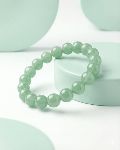 Natural Green Aventurine beaded bracelet featuring 8mm light green translucent stones on white background.