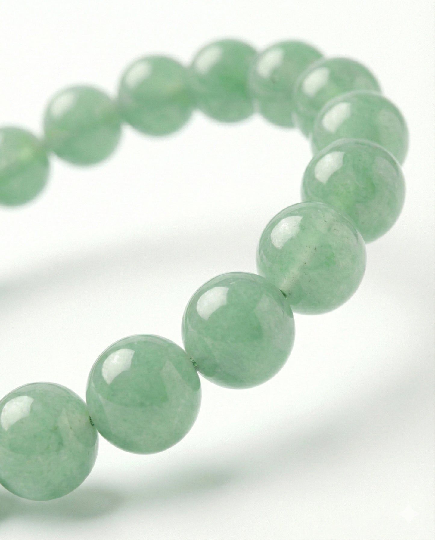 Natural Green Aventurine beaded bracelet featuring 8mm light green translucent stones on white background.
