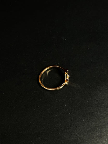 Rose Gold vermeil ring featuring two small butterflies on a dainty band on black background.