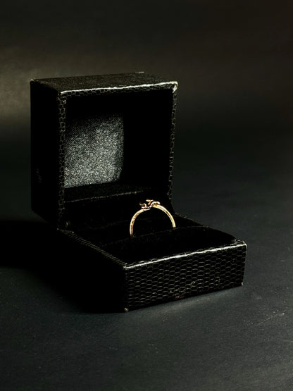 Rose Gold vermeil ring featuring two small butterflies on a dainty band on black background.