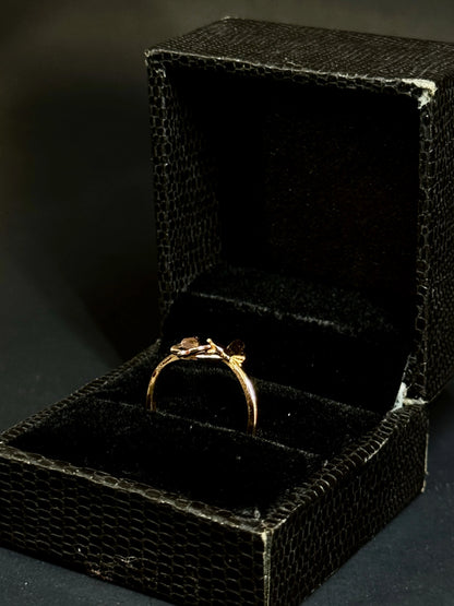 Rose Gold vermeil ring featuring two small butterflies on a dainty band on black background.