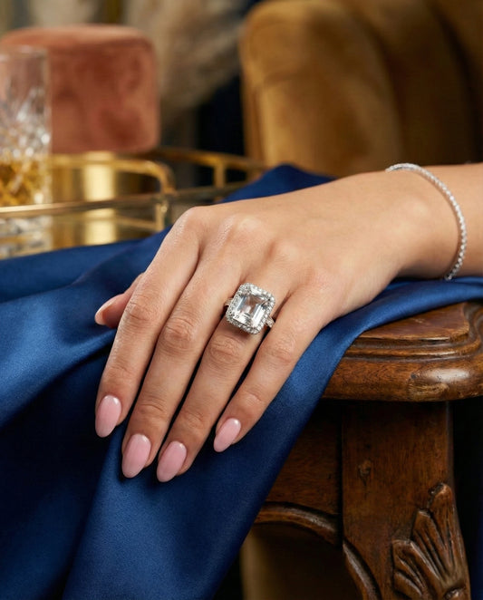 Large rectangular Clear Quartz gemstone ring with halo setting in 925 sterling silver on black background